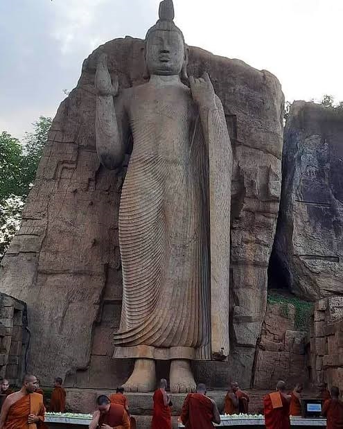 The Avukana stone statue is a standing Buddha statue. The statue stands more than 14 m (46 ft.) tall.